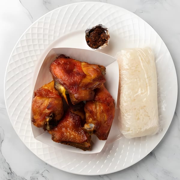 Laos-style grilled chicken in a white container, sticky rice in plastic, and a small cup of sauce.